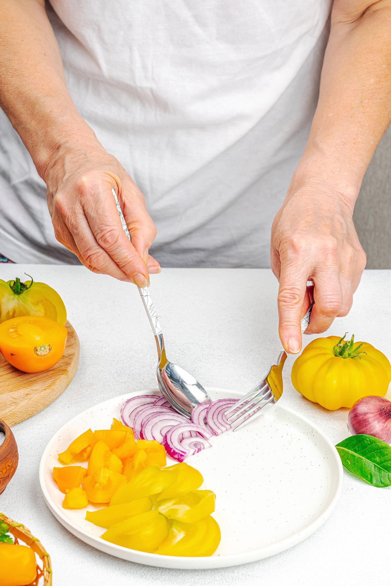 Chef preparing a rustic dish in a bright kitchen